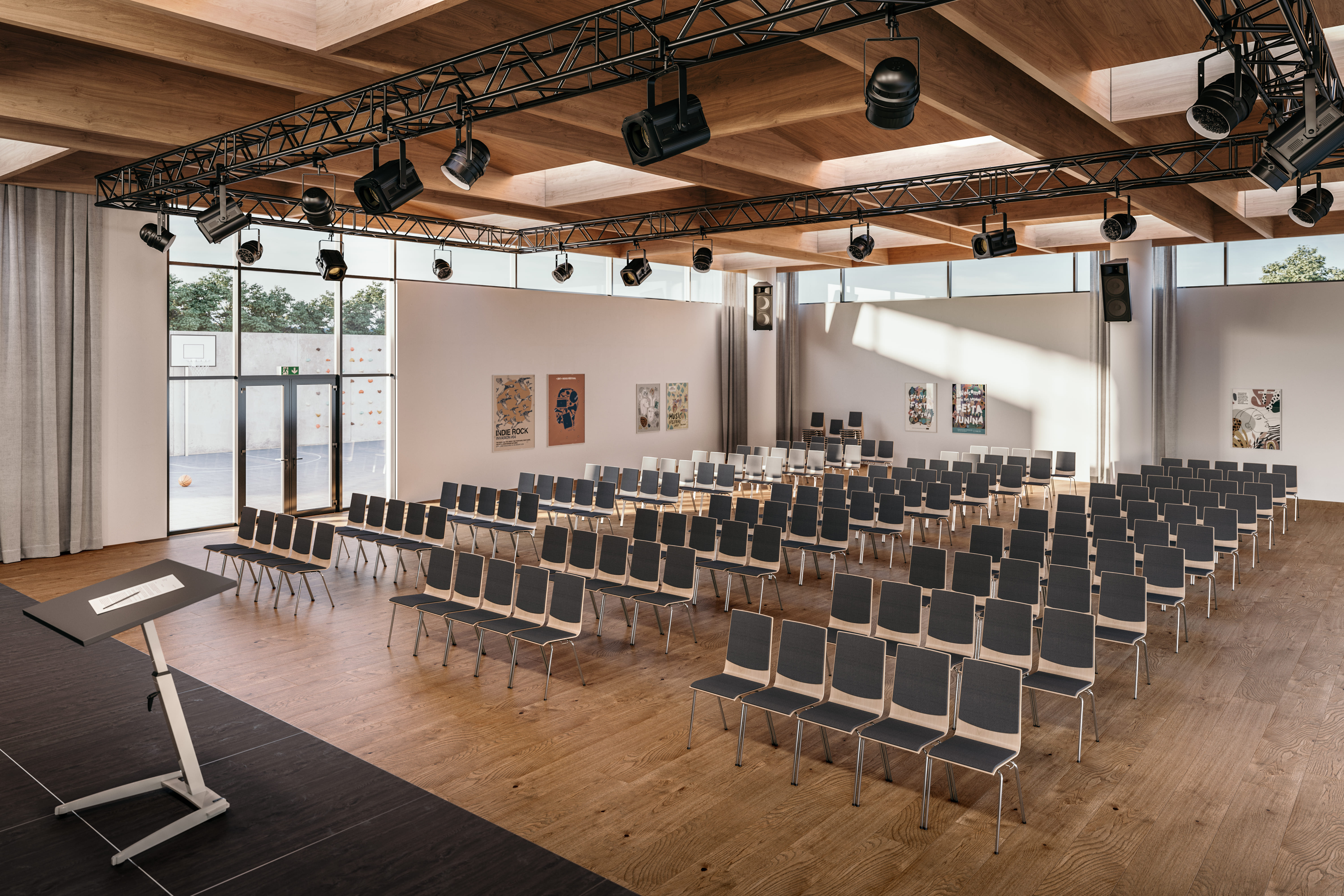 LP ASSMANN Auditorium Auf dem Bild sieht man eine große Veranstaltungshalle mit mehreren Stuhlreihen hintereinander. Vorne steht ein Rednerpult auf einer Bühne.